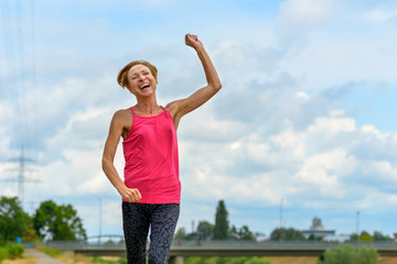 Laughing extrovert woman rejoicing outdoors