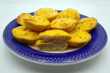 Shrimp pancakes on a blue and white ceramic plate, white background