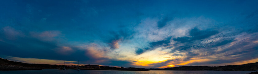 Sunset panorama over sea Beautiful cloudscape over the sea, sunrise / sunrise