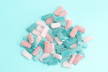 Beads and bracelets of sweets  candy on a turquoise background