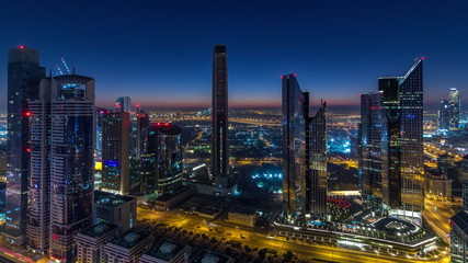 Fototapeta na wymiar Dubai downtown skyline with tallest skyscrapers and traffic on highway night to day timelapse