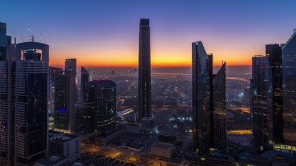Fototapeta premium Dubai downtown skyline with tallest skyscrapers and traffic on highway night to day timelapse