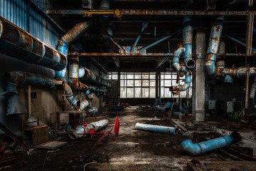 Dark industrial interior with pipes