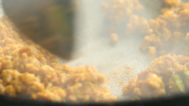 Frying minced pork with yellow curry paste, southern Thai food