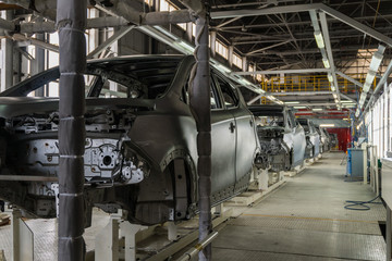 Fototapeta na wymiar The series consists of metal bodies of cars at the automobile plant .