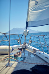 View of a sailing ship front deck and open sea.