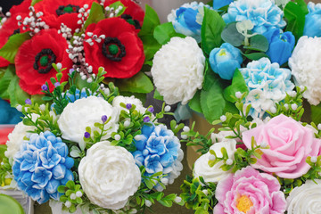 Handmade soap in the form of flowers close-up, selective focus. The concept of congratulations on the wedding, birthday, international women's day, mother's day.