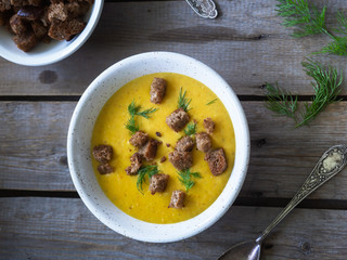 Fragrant vegetable soup-puree with cheese sprinkled with crackers and dill