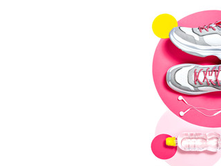 Pair of sport shoes, earphones and water.