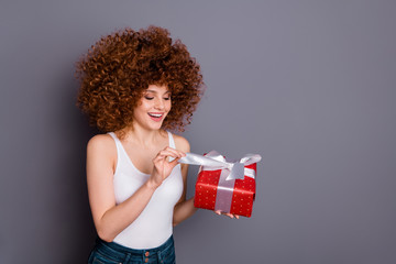 Close up photo of pretty lady big giftbox hands ecstatic open curious what inside wear white tank-top isolated grey background