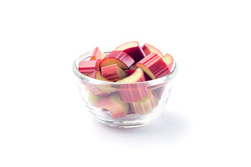 Cut rhubarb in a glass dish, isolated on  white background