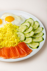 Boiled rice with salmon fish on plate