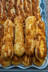 Pile of caramel choux pastry for sale at bakeshop