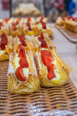Fresh puff pastry with sweet strawberry on tray at patisserie