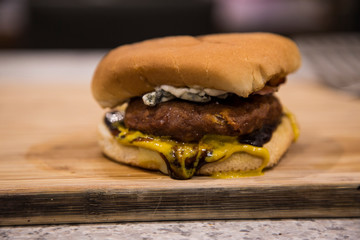 Vegan burger patty with bacon and blue cheese. Flexitarian, more plant based food, less meat....
