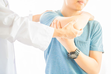 Close up of Physiotherapist working with patient in clinic