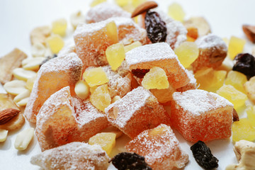 Turkish delight, nuts, dried fruits are mixed on the table