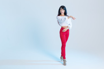 Latin dance, contemporary dance, bachata solo and cha-cha-cha concept - portrait of a young woman...