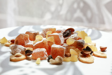 Turkish delight, nuts, dried fruits are mixed on the table