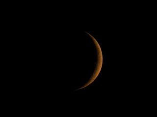 Obraz na płótnie Canvas Waxing crescent moon seen with telescope