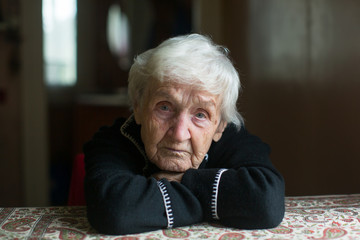 Close-up portrait of an elderly meloncholic pensioner woman.