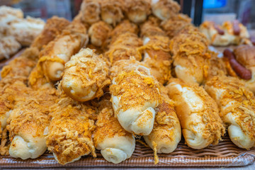 Pile of meat floss bun on tray at pastry shop