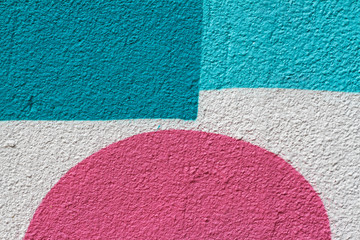 Blue and white painted wall with pink semicircle as background or texture