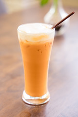 Thai milk tea in the glass with straw