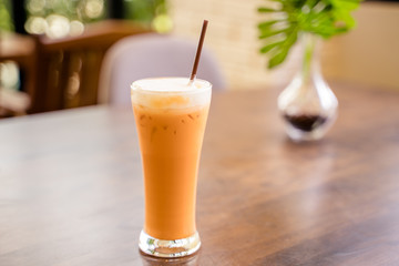 Thai milk tea in the glass with straw
