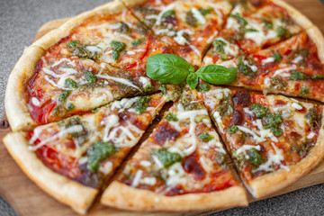 pizza with pesto tomatoes and mozzarella