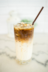 Closeup a glass of iced espresso machiano