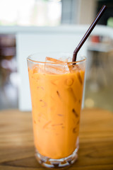 Thai milk tea in the glass with straw
