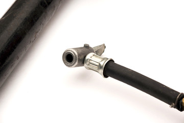 rubber hose with metal nozzle for high pressure durable black with metal tip on white background...