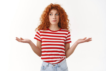 How should I know. Ignorant sassy redhead curly-haired good-looking woman shrugging perplexed look aside lying hands spread sideways clueless trying hide truth acting questioned, white background