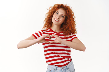 Love summer. Attractive tender feminine redhead curly girl 25s blue eyes smiling delighted tilting...