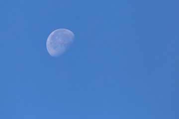 view on Moon in a clear blue sky