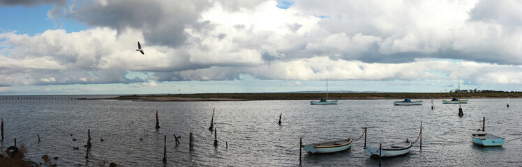 panoramic view of small fishing sail boats tide up in port in an inlet at Werribee south beach, Werribee Victoria