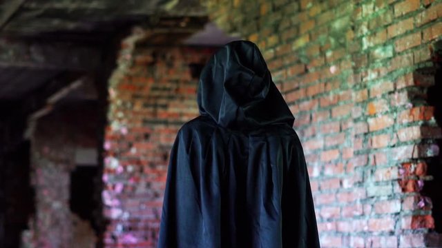 an evil monk in the hood