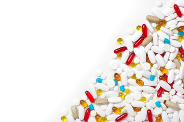  Pills, tablets and capsules on white background.