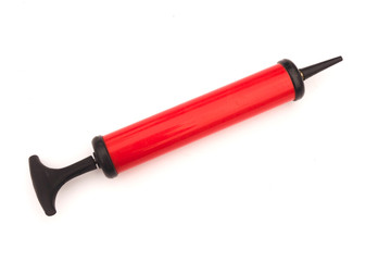 red hand pump for ball on white background.