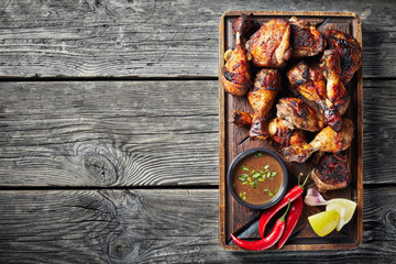 hot Grilled Jamaican Jerk Chicken, close up - obrazy, fototapety, plakaty