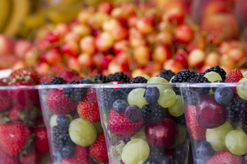 different wild berries and mushrooms on a counter in day