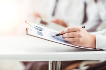 businessman working with the marketing schedule for the workplace
