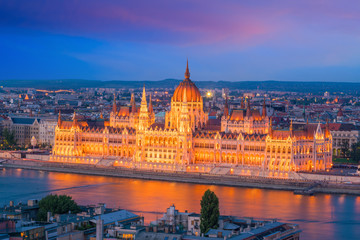 Fototapeta na wymiar Parliament building over delta of Danube river in Budapest
