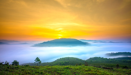 Naklejka na ściany i meble Dawn on the mountain plateau mist covered valley in Da Lat, Vietnam. All create wonderful views in the morning of the beautiful new day