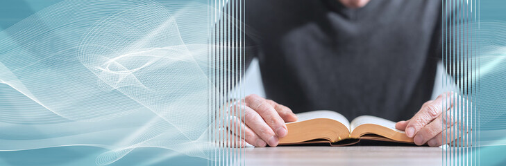 Man reading a book; panoramic banner