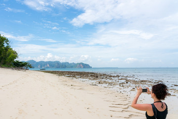 young cute hipster girl travelling at beautiful blue sky paradise tropical  coast beach PP Island Krabi Phuket Thailand guiding idea for long weekend  female relax rest woman women planning life