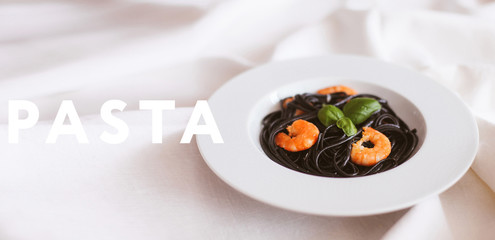Black pasta with shrimps and basil
