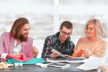 Obraz premium modern designer and his team is working on new models in apparel