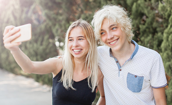 Young smiling couple taking a selfie portrait